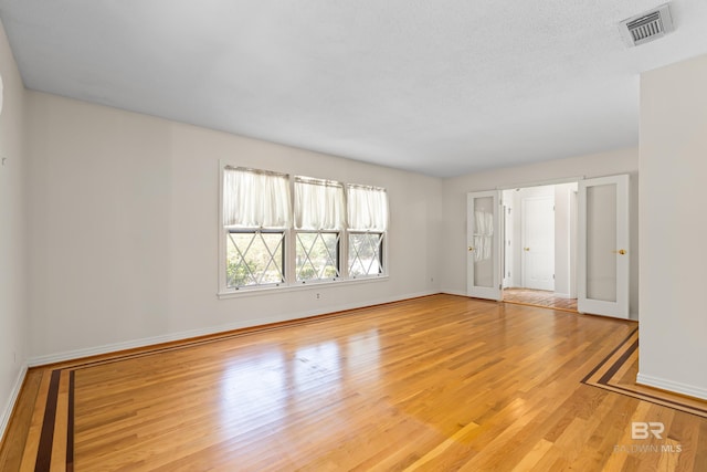 606 Fairhope Ave, Fairhope, AL 36532 - empty room with wood finished floors and baseboards