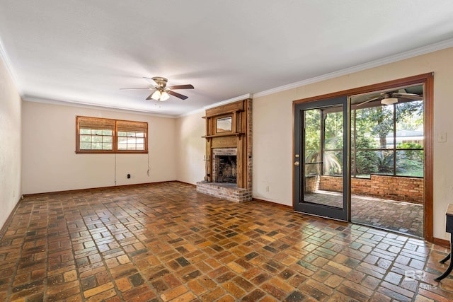606 Fairhope Ave, Fairhope, AL 36532 - unfurnished living room featuring a ceiling fan, a fireplace, baseboards, ornamental molding, and brick floors