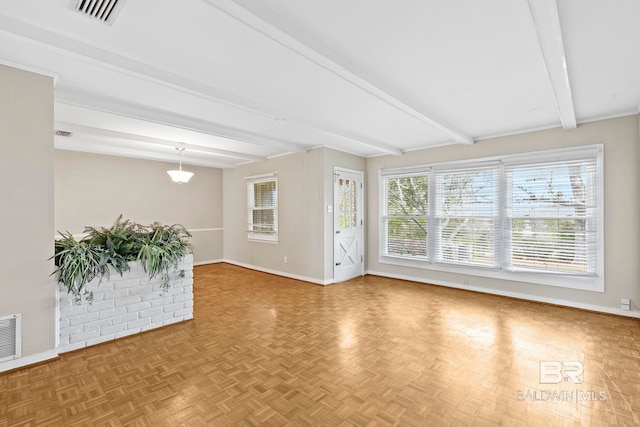 spare room with parquet floors and beam ceiling