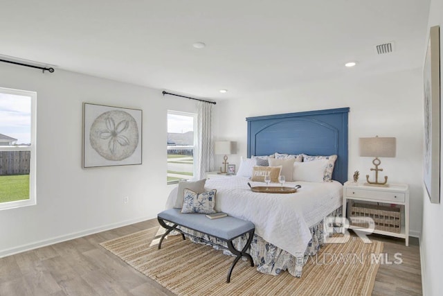 bedroom with light hardwood / wood-style floors