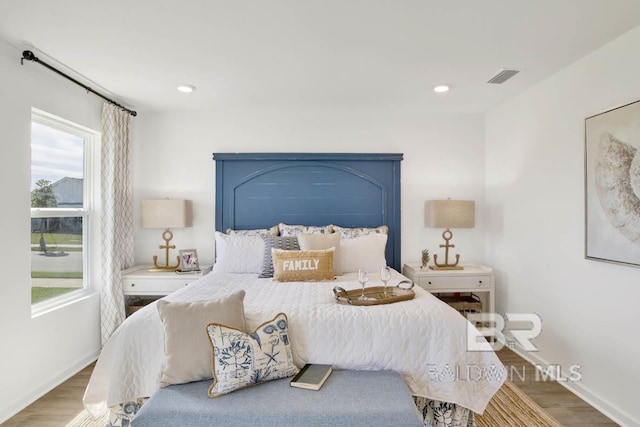 bedroom with wood-type flooring