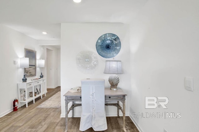 dining space with hardwood / wood-style floors