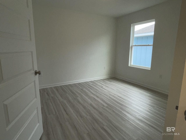 unfurnished room featuring light wood-type flooring