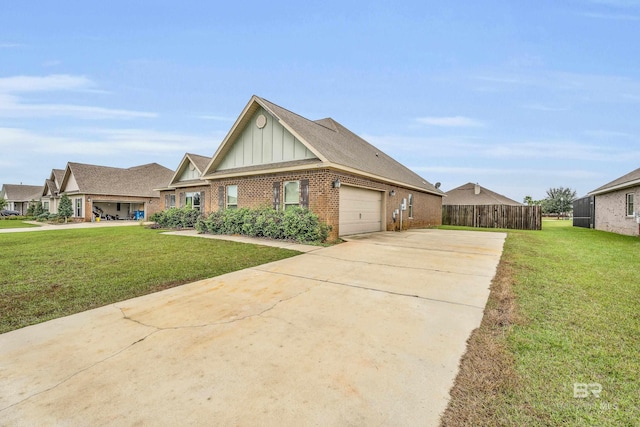 view of front of property with a front yard and a garage