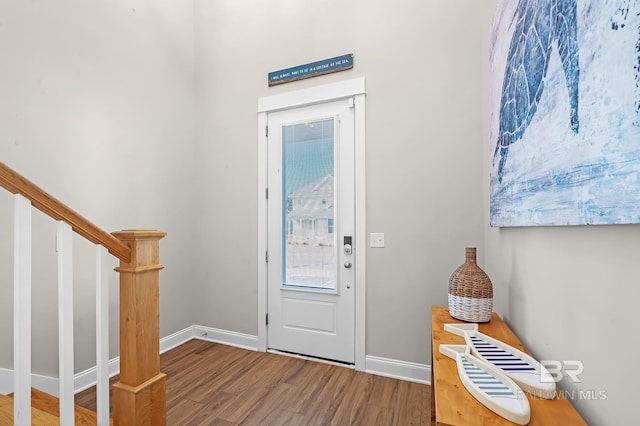 entryway with hardwood / wood-style floors