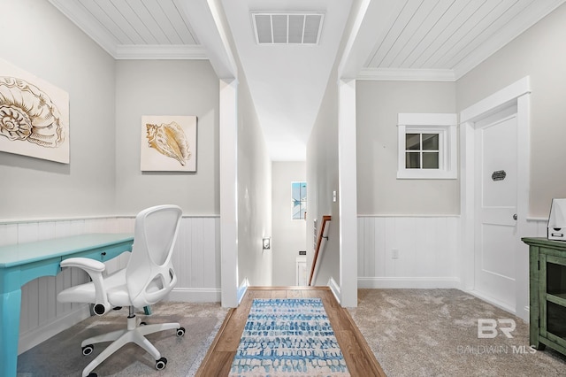 office space featuring wood-type flooring and crown molding