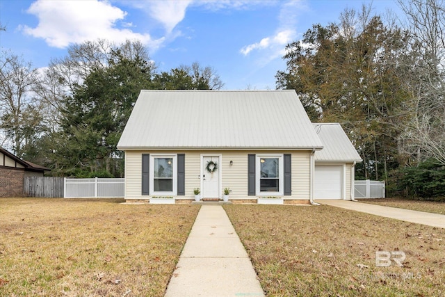 view of front of house with a garage and a front yard