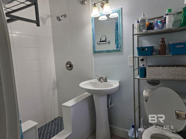 1411 Mcmillan Ave, Brewton, AL 36426 - bathroom with tiled shower and toilet
