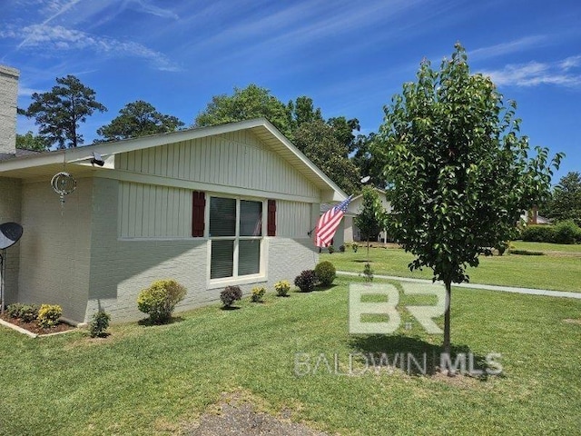 1411 Mcmillan Ave, Brewton, AL 36426 - view of property exterior with a yard and a chimney
