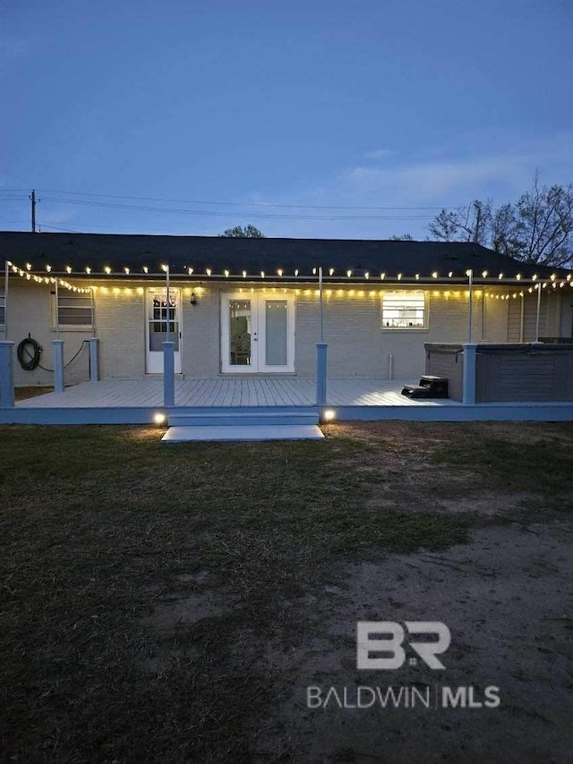 property exterior at dusk with a yard