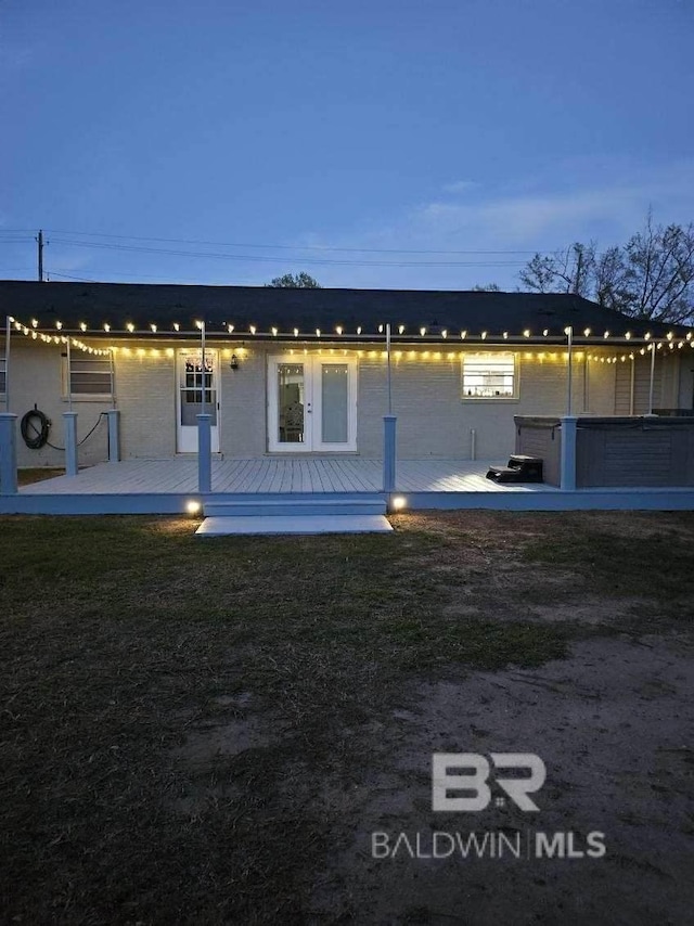 1411 Mcmillan Ave, Brewton, AL 36426 - view of home's exterior with a wooden deck and brick siding