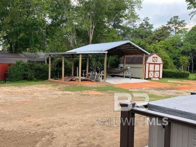 view of yard featuring a patio and a storage unit