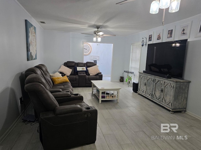 living room featuring light hardwood / wood-style floors and ceiling fan