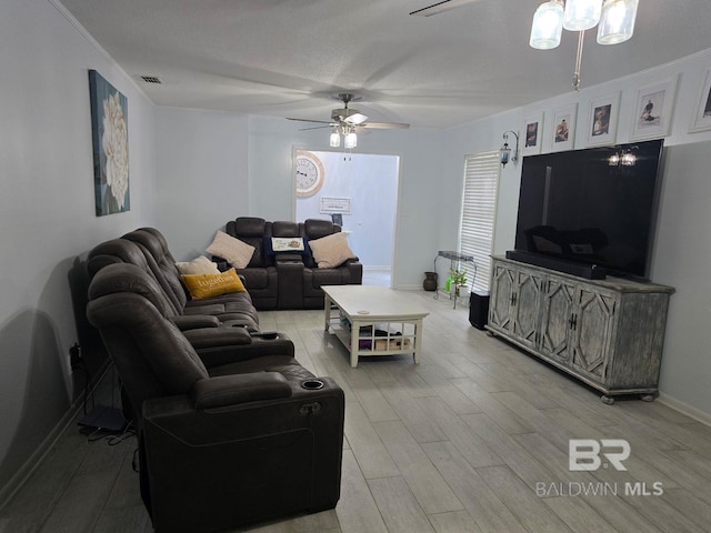 1411 Mcmillan Ave, Brewton, AL 36426 - living room with a ceiling fan, light wood-style flooring, and baseboards