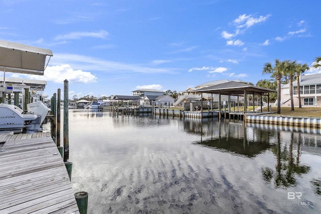 dock area with a water view and boat lift