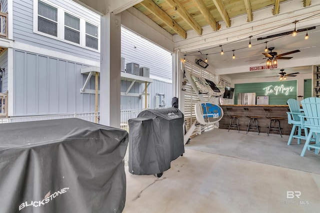 view of patio with a grill and outdoor dry bar