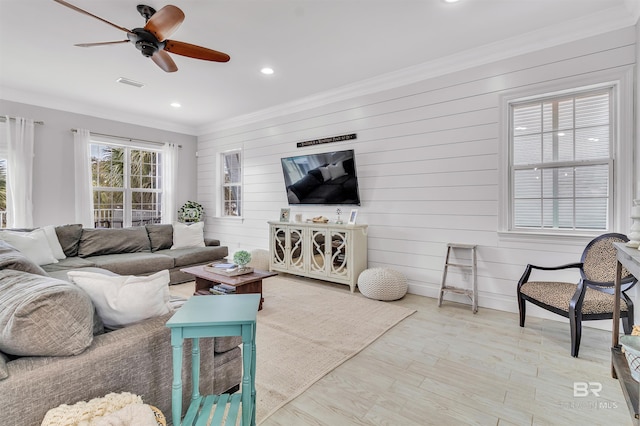 living room featuring visible vents, ceiling fan, wood finished floors, crown molding, and recessed lighting