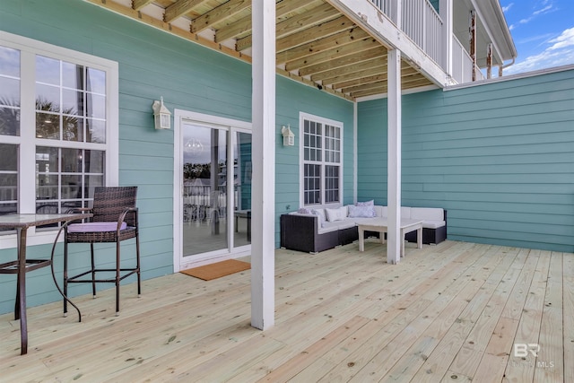 wooden deck with an outdoor hangout area