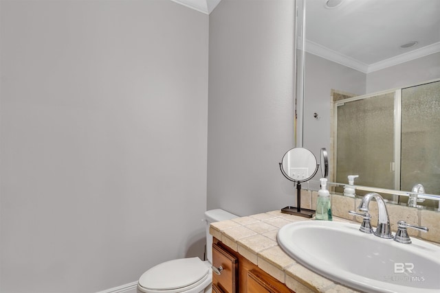 full bathroom featuring vanity, ornamental molding, a shower stall, and toilet