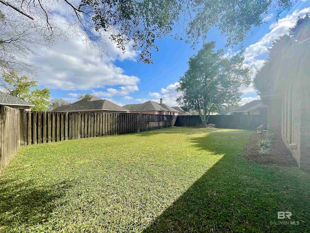 view of yard featuring a fenced backyard