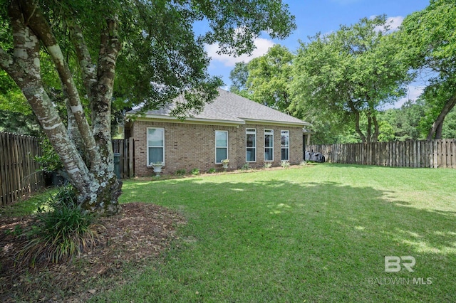 13713 Kearny Dr, Loxley, AL 36551 - back of house featuring brick siding and a shingled roof