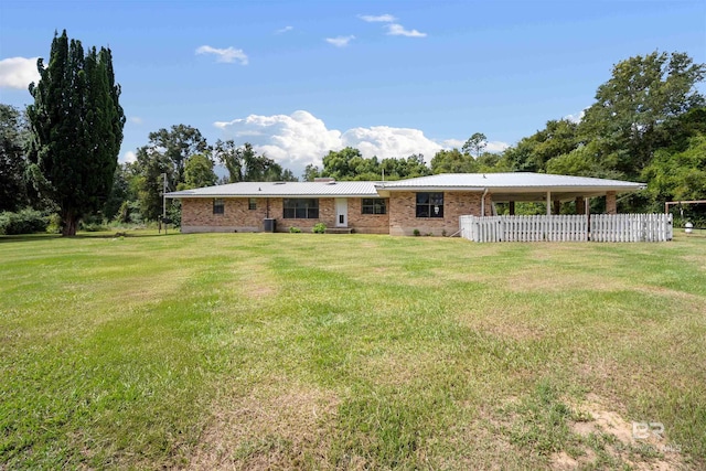 back of house with a lawn