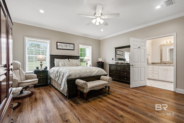 bedroom with crown molding, ceiling fan, ensuite bathroom, and dark hardwood / wood-style floors