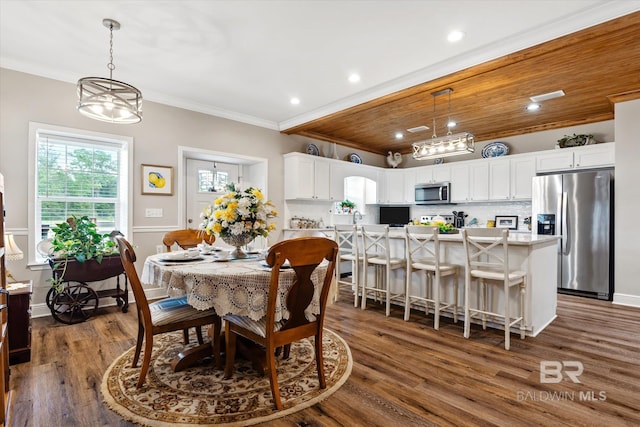 dining area featuring crown molding, wood ceiling, and dark hardwood / wood-style floors