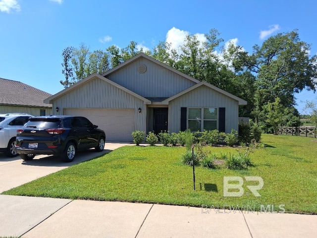 32299 Terranova Loop, Lillian, AL 36549 - ranch-style house with a garage, a front yard, and concrete driveway
