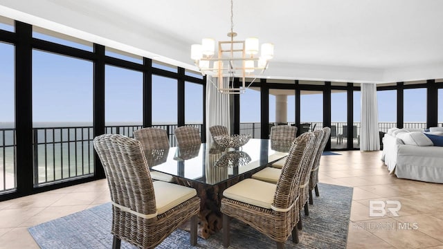 23450 Perdido Beach Blvd Unit 2011, Orange Beach, AL 36561 - dining room featuring a chandelier, light tile patterned flooring, and a water view