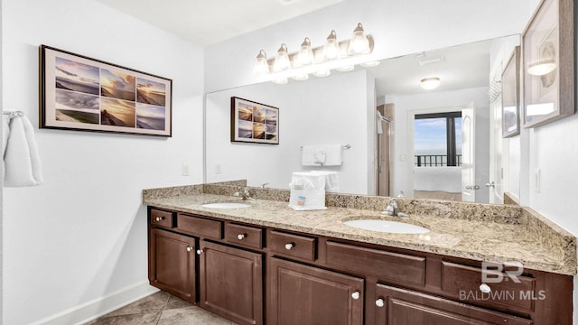 23450 Perdido Beach Blvd Unit 2011, Orange Beach, AL 36561 - full bathroom featuring double vanity, a stall shower, and tile patterned flooring