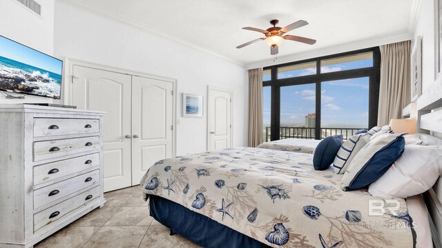 23450 Perdido Beach Blvd Unit 2011, Orange Beach, AL 36561 - bedroom featuring access to outside, a closet, ornamental molding, light tile patterned floors, and ceiling fan