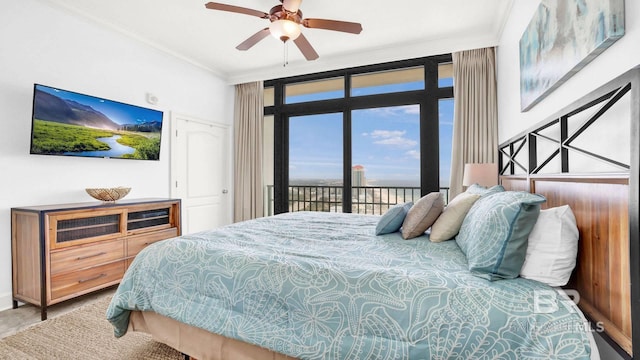 23450 Perdido Beach Blvd Unit 2011, Orange Beach, AL 36561 - bedroom featuring access to exterior, ornamental molding, and ceiling fan