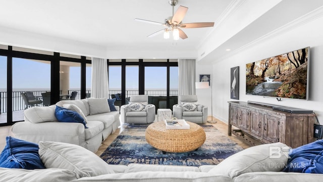 23450 Perdido Beach Blvd Unit 2011, Orange Beach, AL 36561 - living room with crown molding, ceiling fan, and a water view