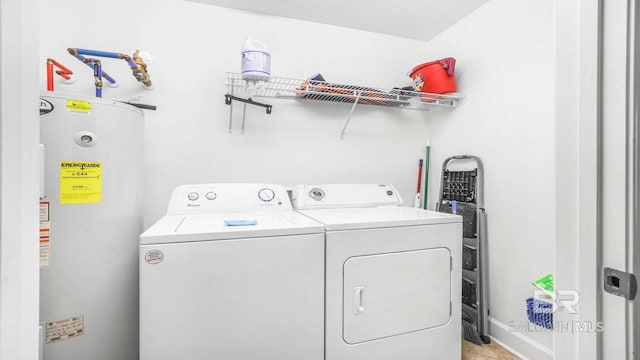 23450 Perdido Beach Blvd Unit 2011, Orange Beach, AL 36561 - laundry room with electric water heater and separate washer and dryer