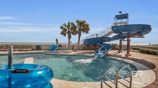 23450 Perdido Beach Blvd Unit 2011, Orange Beach, AL 36561 - community pool with stairs, a water slide, and a patio