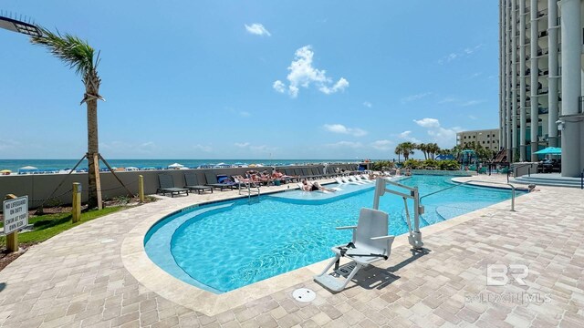 23450 Perdido Beach Blvd Unit 2011, Orange Beach, AL 36561 - community pool with a patio and a water view