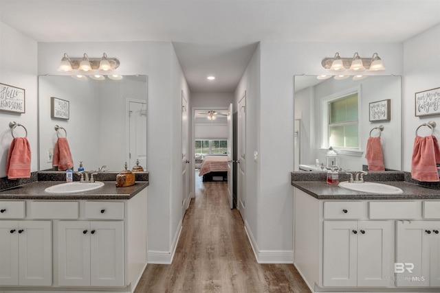 bathroom featuring vanity, ceiling fan, and hardwood / wood-style floors