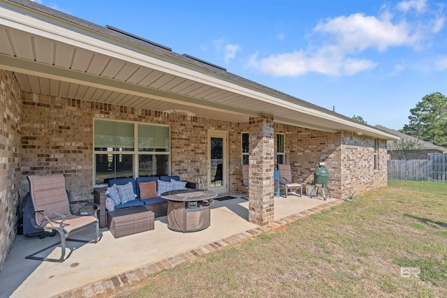 view of patio featuring an outdoor living space with a fire pit