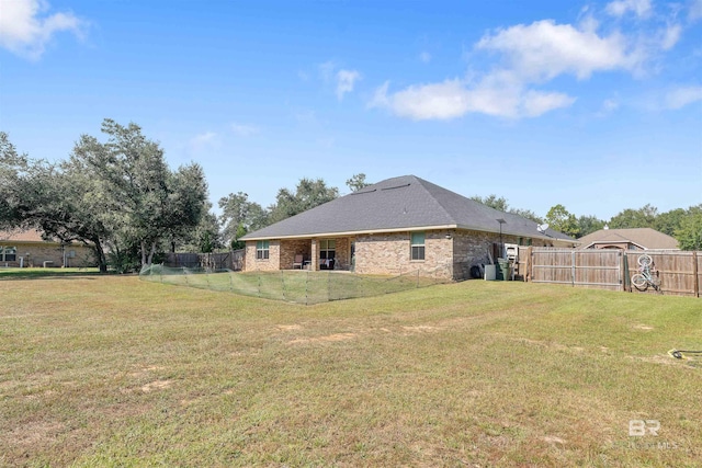 back of house featuring a yard