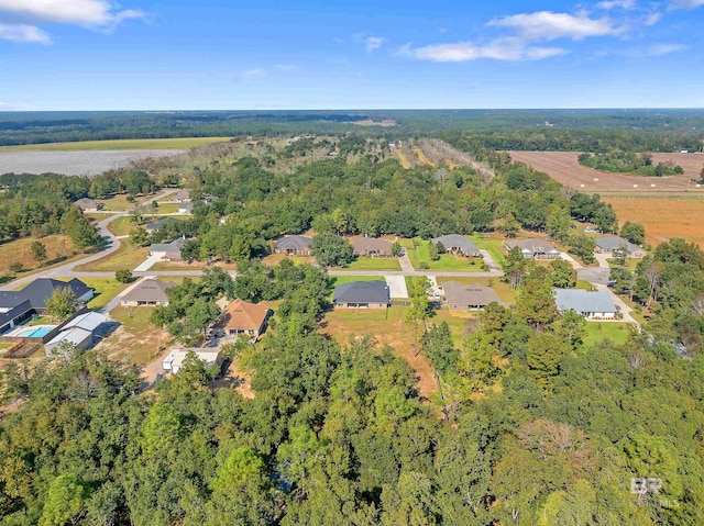drone / aerial view with a residential view and a forest view