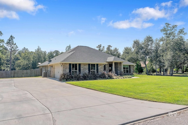 ranch-style home with a front yard and central AC