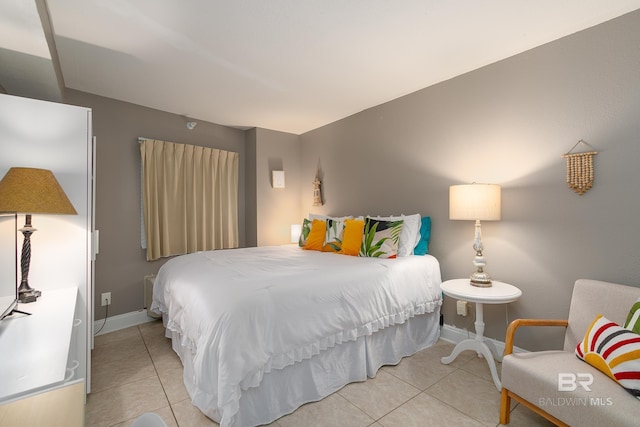 bedroom featuring light tile patterned floors