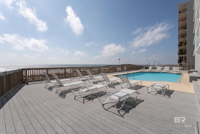 view of pool with a water view