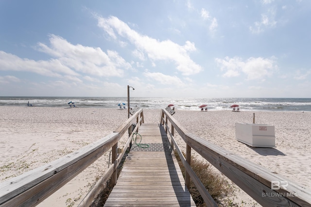 exterior space featuring a water view and a view of the beach