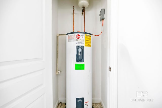 utility room featuring electric water heater