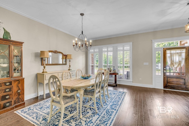 dining space featuring crown molding, dark wood-type flooring, and an inviting chandelier