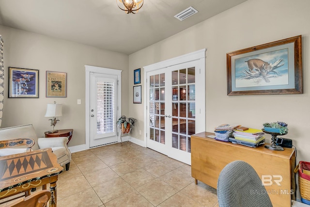 office space with french doors and light tile patterned flooring