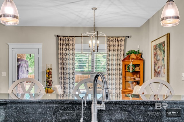 dining space featuring a notable chandelier