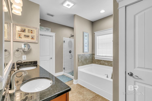 bathroom with plus walk in shower, tile patterned floors, and vanity